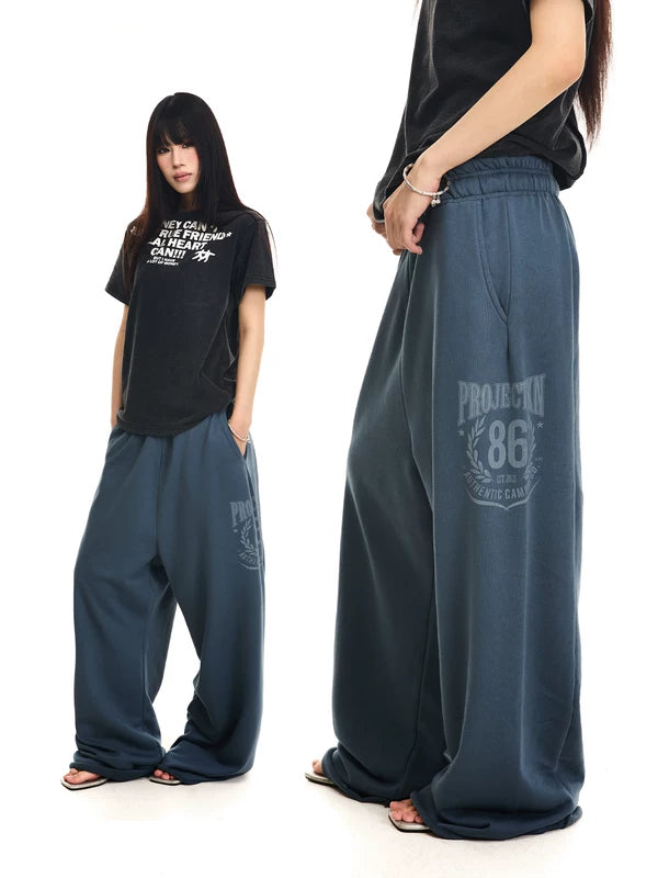 Distressed Printed Oversized Wide-Leg Sweatpants 1